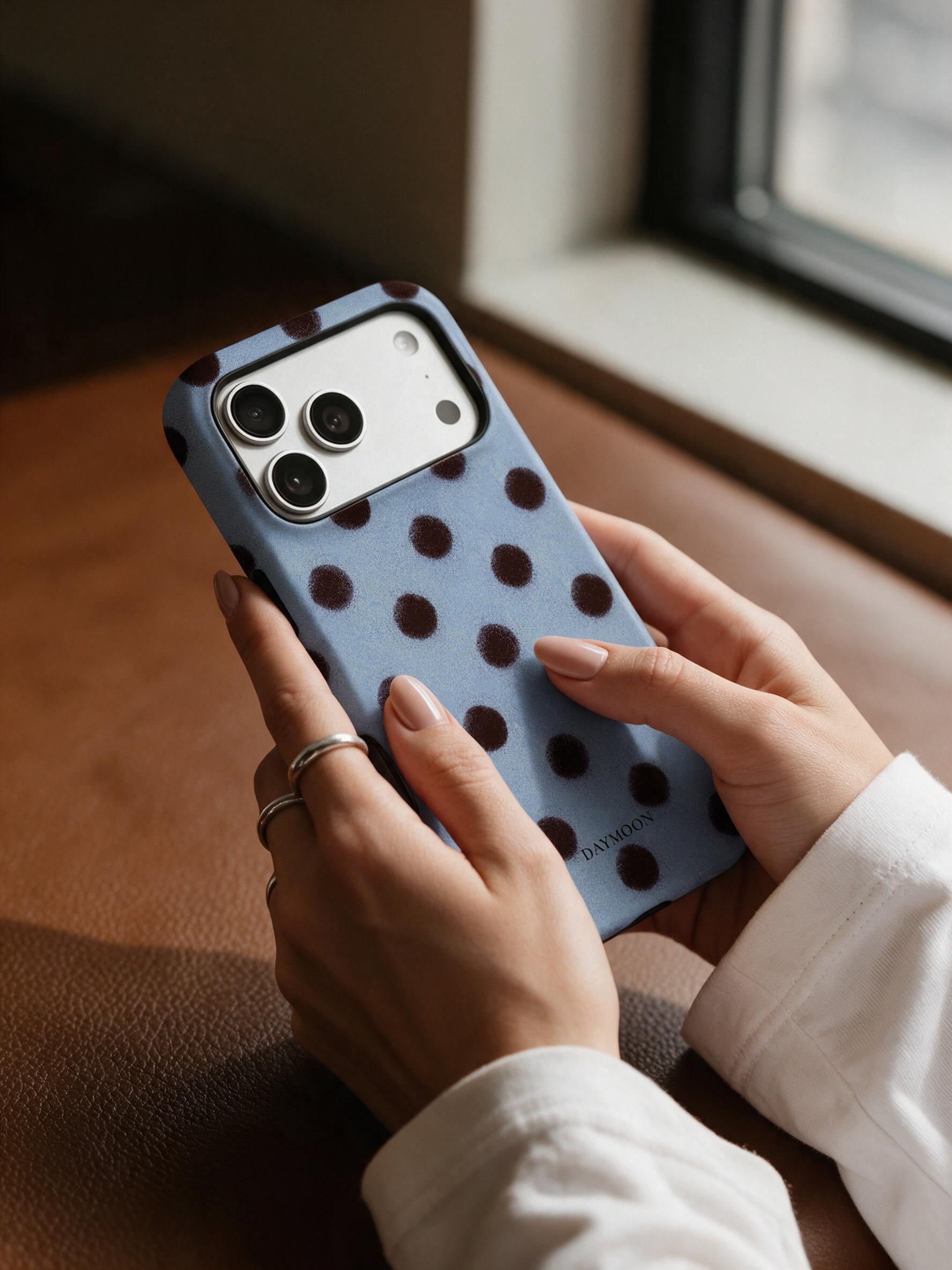 Cocoa Rhythm phone case in an everyday hand detail scene