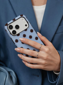 Cocoa Rhythm phone case in an everyday hand detail scene