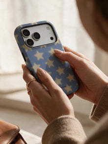 Dusky Stars phone case in an everyday hand detail scene