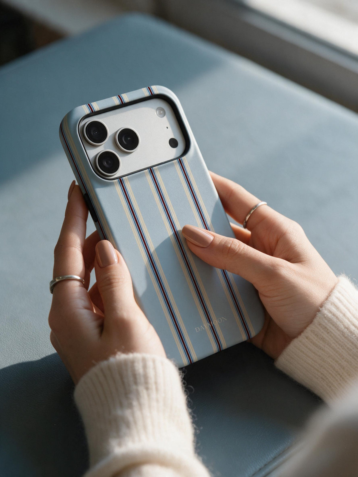 Dusty Stripe phone case in an everyday hand detail scene