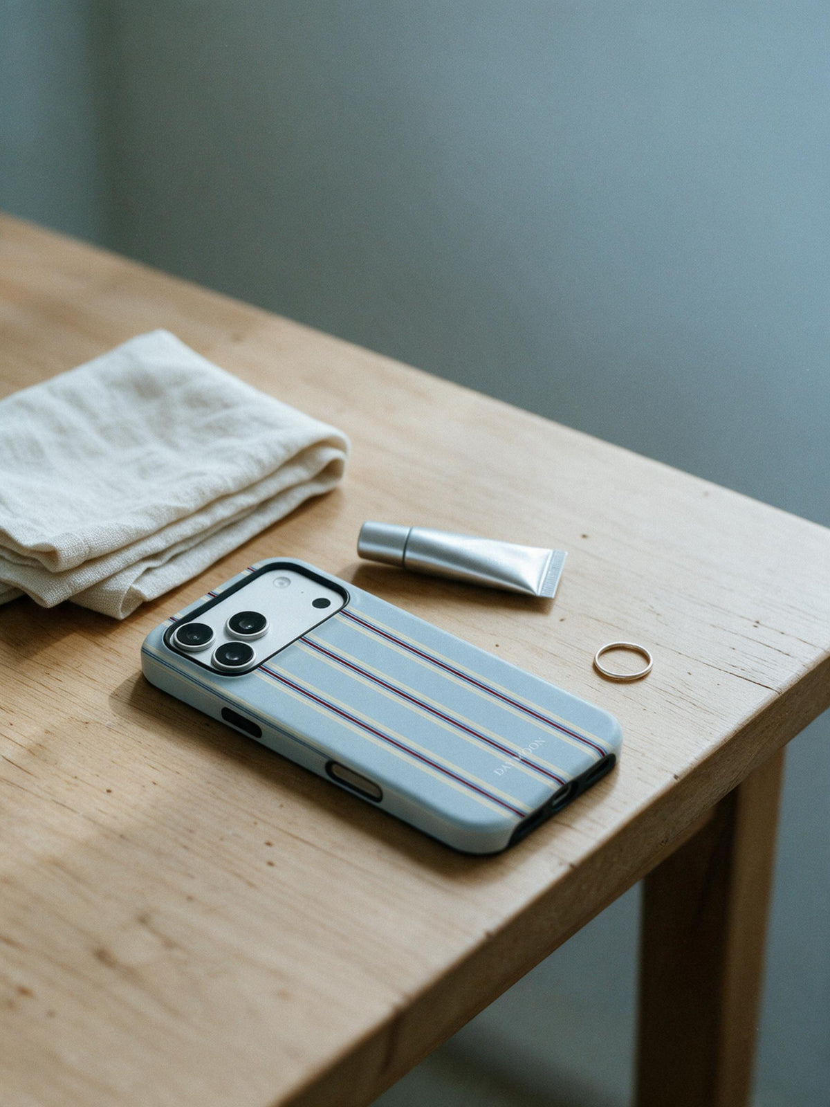 Dusty Stripe phone case in an everyday daily still life scene