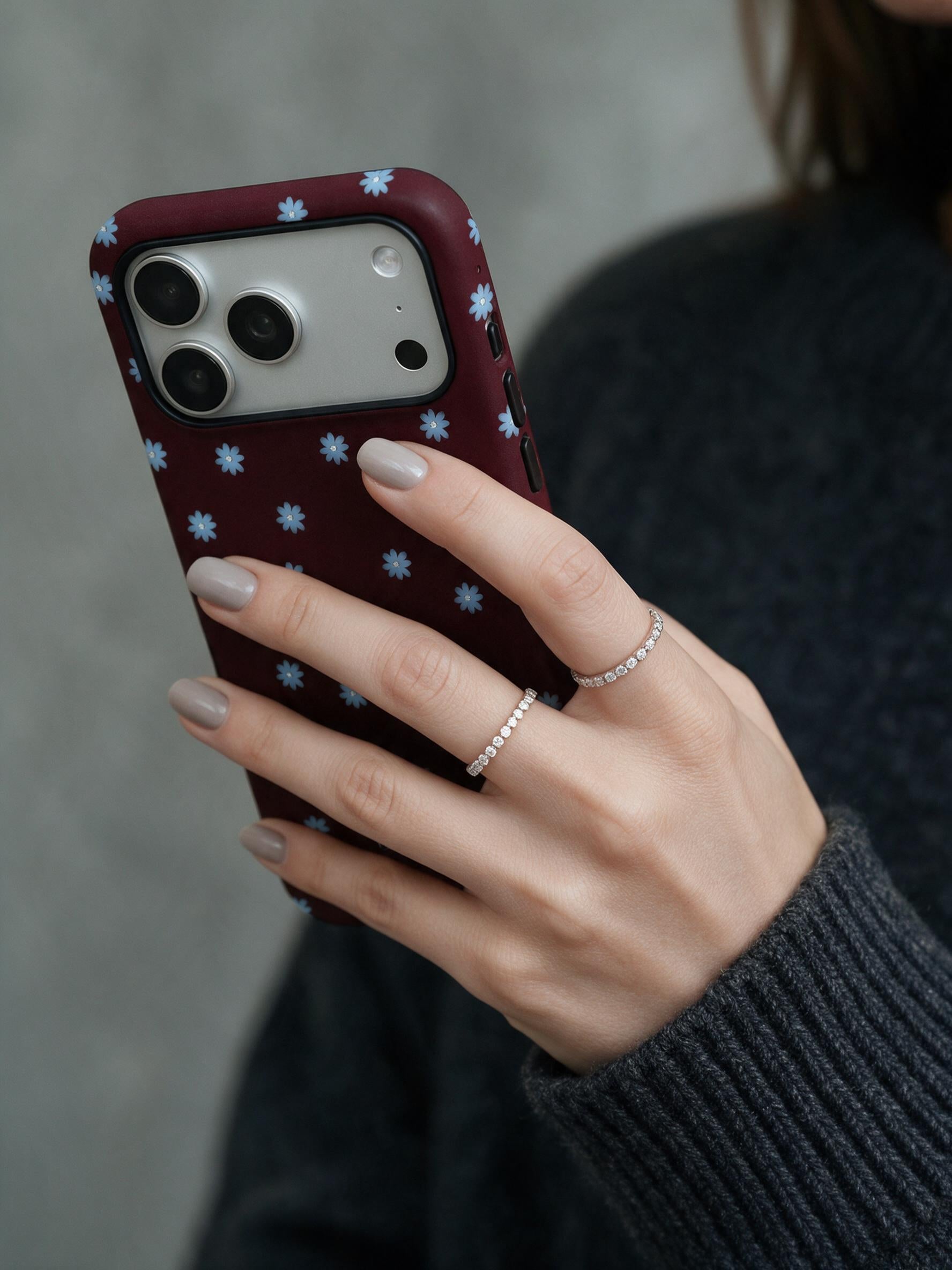 Wine Bloom phone case in an everyday hand detail scene