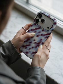 Hazy Dot phone case in an everyday hand detail scene